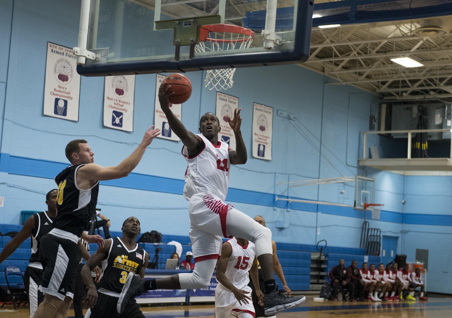 SAN ANTONIO (Nov. 01, 2017) - U.S. Marine Corps Cpl. Sean Stewart, assigned to Marine Corps Base Okinawa scores a layup during a basketball game. The 2017 Armed Forces Basketball Championship is held at Joint Base San Antonio, Lackland Air Force Base from 1-7 November. The best two teams during the double round robin will face each other for the 2017 Armed Forces crown. (U.S. Navy photo by Mass Communication Specialist 2nd Class Emiline L. M. Senn/Released)