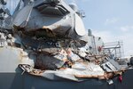 The guided missile destroyer USS Fitzgerald sits in Dry Dock 4 at Fleet Activities Yokosuka, Japan, for repairs and damage assessments.