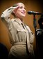 Performing on her first tour, TSgt Hillary Grobe appears in the Pinks and Greens costume of the Glenn Miller era. (U.S. Air Force Photo courtesy of CMSgt Bob Kamholz/Released)
