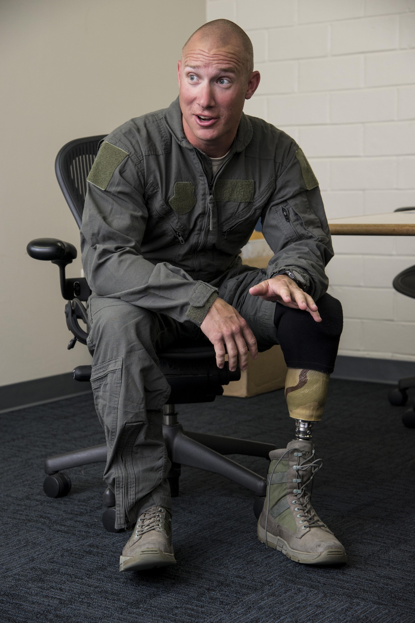 Air Force Master Sgt. Benjamin Seekell, 343rd Training Squadron security forces apprentice course flight chief and Wounded Warrior, dons a flight suit before his incentive flight with the U.S. Air Force Aerial Demonstration Squadron “Thunderbirds” Nov. 2, 2017, at Joint Base San Antonio-Kelly Field, Texas. During a 2011 deployment to Afghanistan, Seekell, who was serving as a military working dog handler, was injured in an improvised explosive device attack and lost his left leg. (U.S. Air Force photo by Senior Airman Stormy Archer)