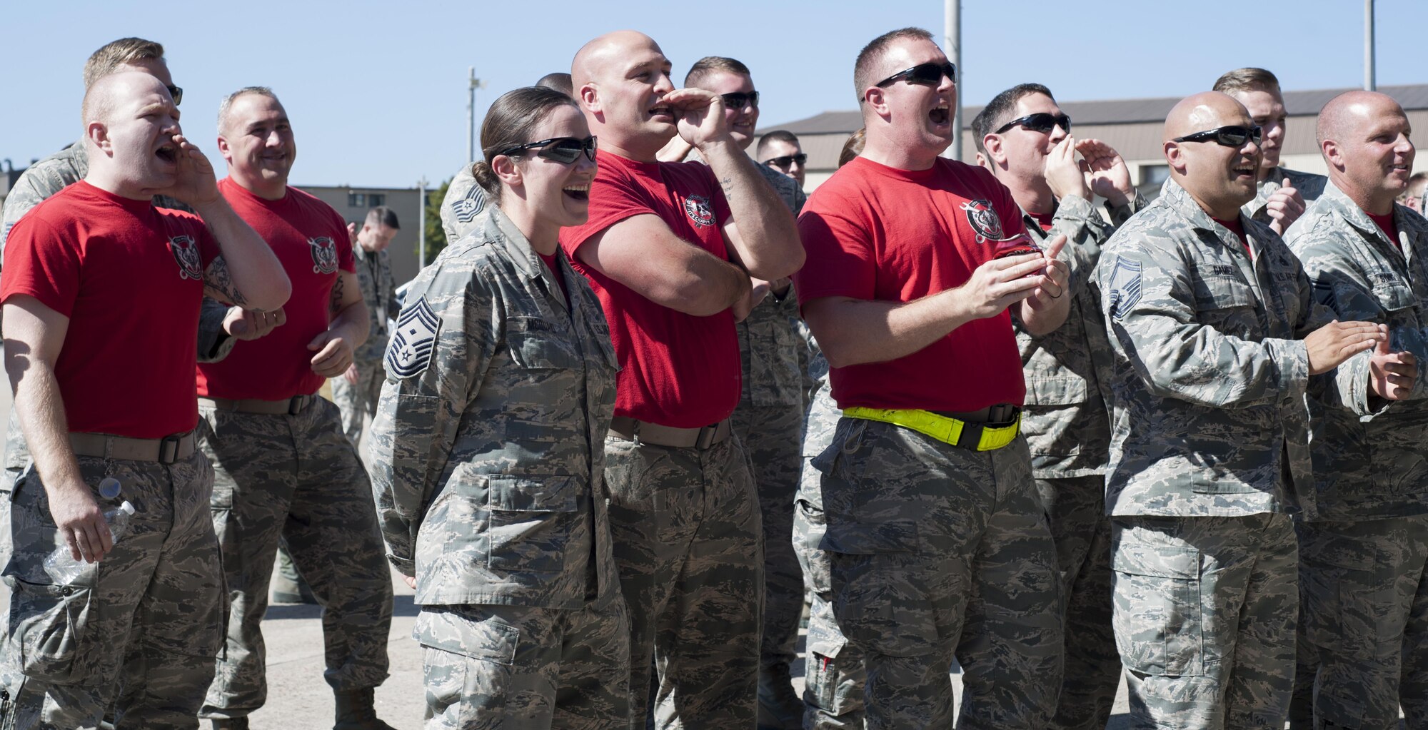 U.S. Air Force Airmen assigned to the Wisconsin Air National Guard 115th Fighter Wing cheer on their teammates during a weapons load competition at Kunsan Air Base, Republic of Korea, Oct. 20, 2017. The 8th Maintenance Group weapons standardization team hosted the competition to showcase the skills and abilities of each Aircraft Maintenance Unit squadron as well as to promote espirit de corps. (U.S. Air Force photo by Staff Sgt. Victoria H. Taylor)