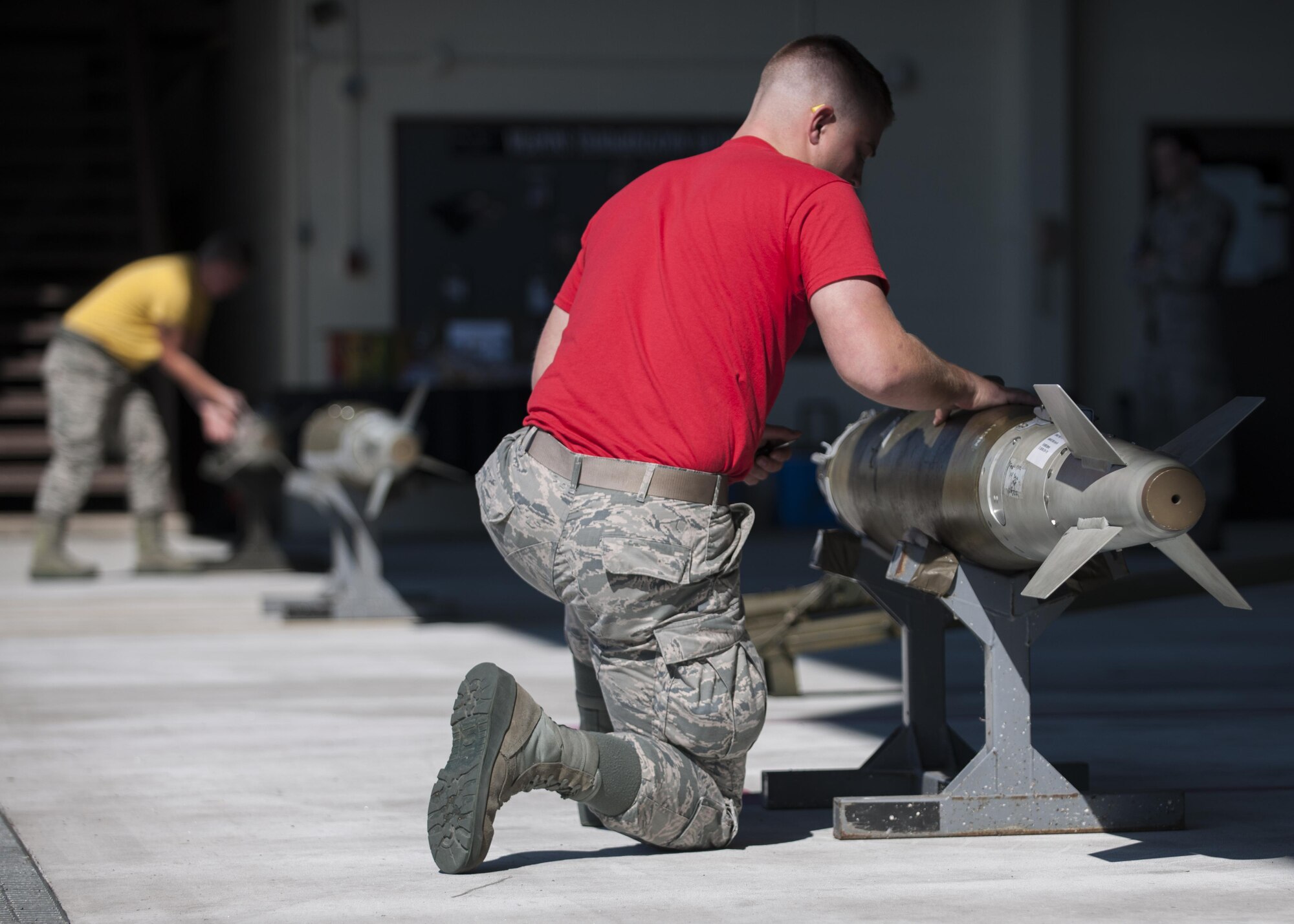 U.S. Air Force Senior Airman Joseph David, Wisconsin Air National Guard 115th Fighter Squadron weapons load crew member, inspects munitions during a weapons load competition at Kunsan Air Base, Republic of Korea, Oct. 20, 2017. The Wisconsin Air National Guard 115th Fighter Wing, along with the 80th Aircraft Maintenance Unit and the 35th Aircraft Maintenance Unit competed in a weapons load competition for the first time during the 115th FW’s theater security package deployment to the Wolf Pack. (U.S. Air Force photo by Staff Sgt. Victoria H. Taylor)