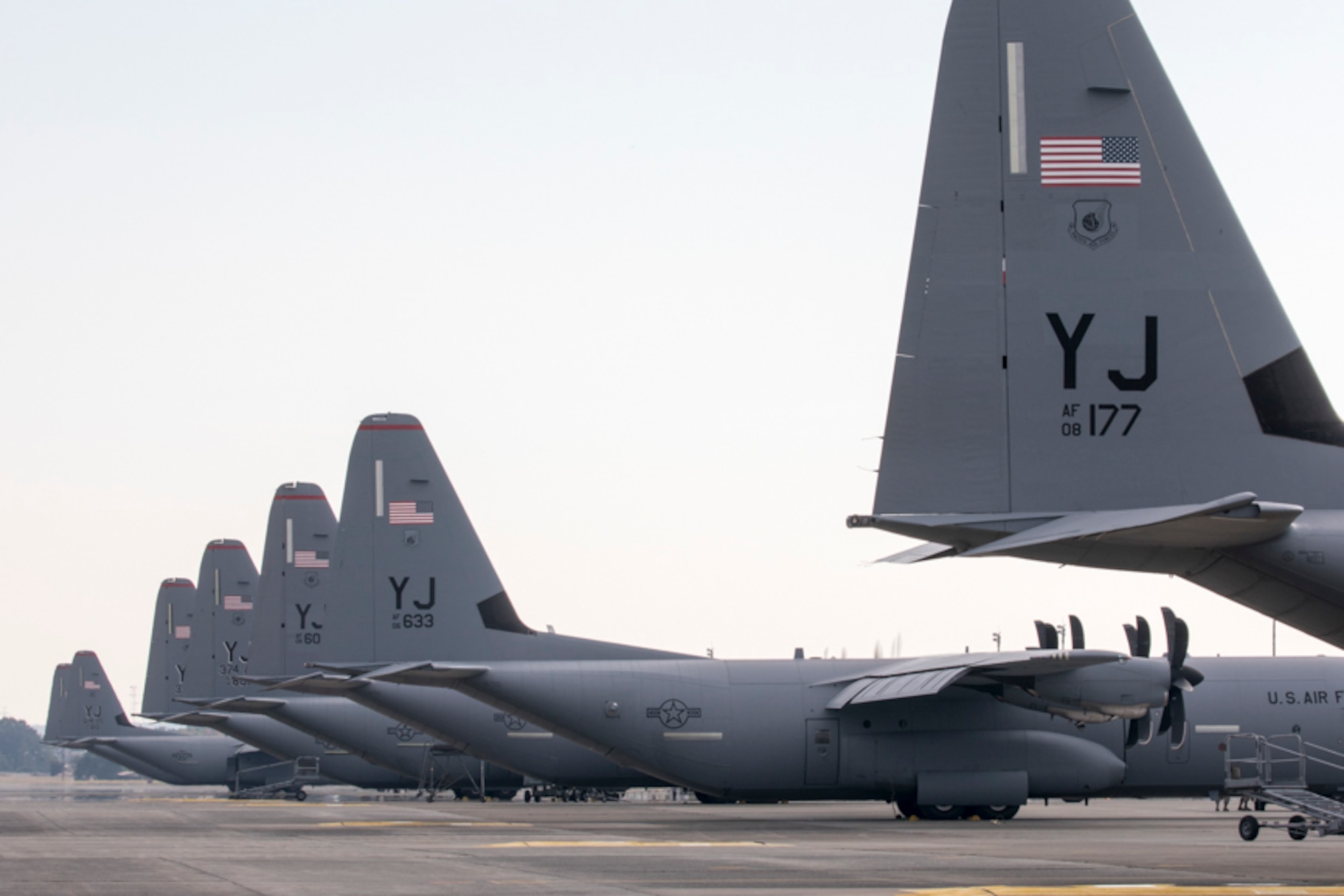 Seven C-130J Super Hercules' aircraft from the 36th Airlift Squadron sit on the flightline at Yokota air base, Japan, Nov. 1, 2017.