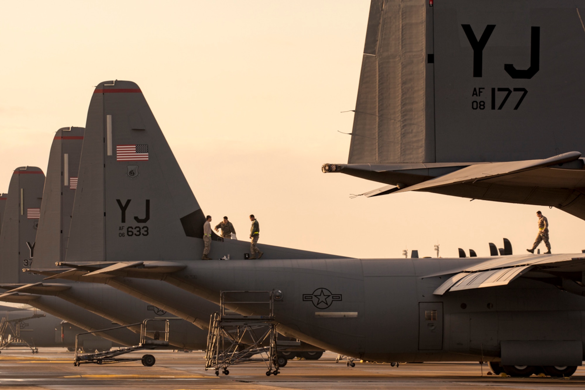 Crew chiefs assigned to the 374th Aircraft Maintenance Squadron perform maintaining a C-130J Super Hercules at Yokota Air Base, Japan, Nov. 3, 2017.