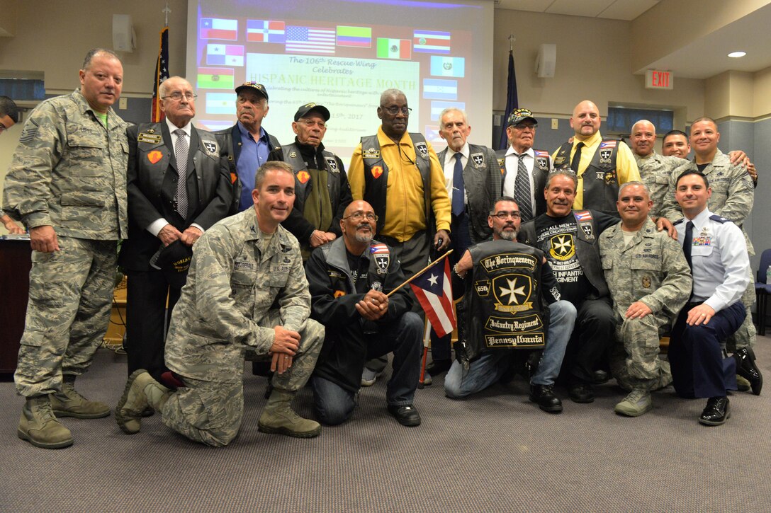 Members of the 106th Rescue Wing stand with the Borinqueneers for a group photo during the Hispanic Heritage Month celebration at New York Air National Guard’s 106th Rescue Wing in Westhampton Beach, New York on October 15, 2017. The event honored the Borinqueneers, the U.S. Army’s 65th Infantry Regiment made up by the U.S. Territory of Puerto Rico, who served during both World Wars and the Korean War. (U.S. Air National Guard photo by Airman 1st Class Daniel H. Farrell)