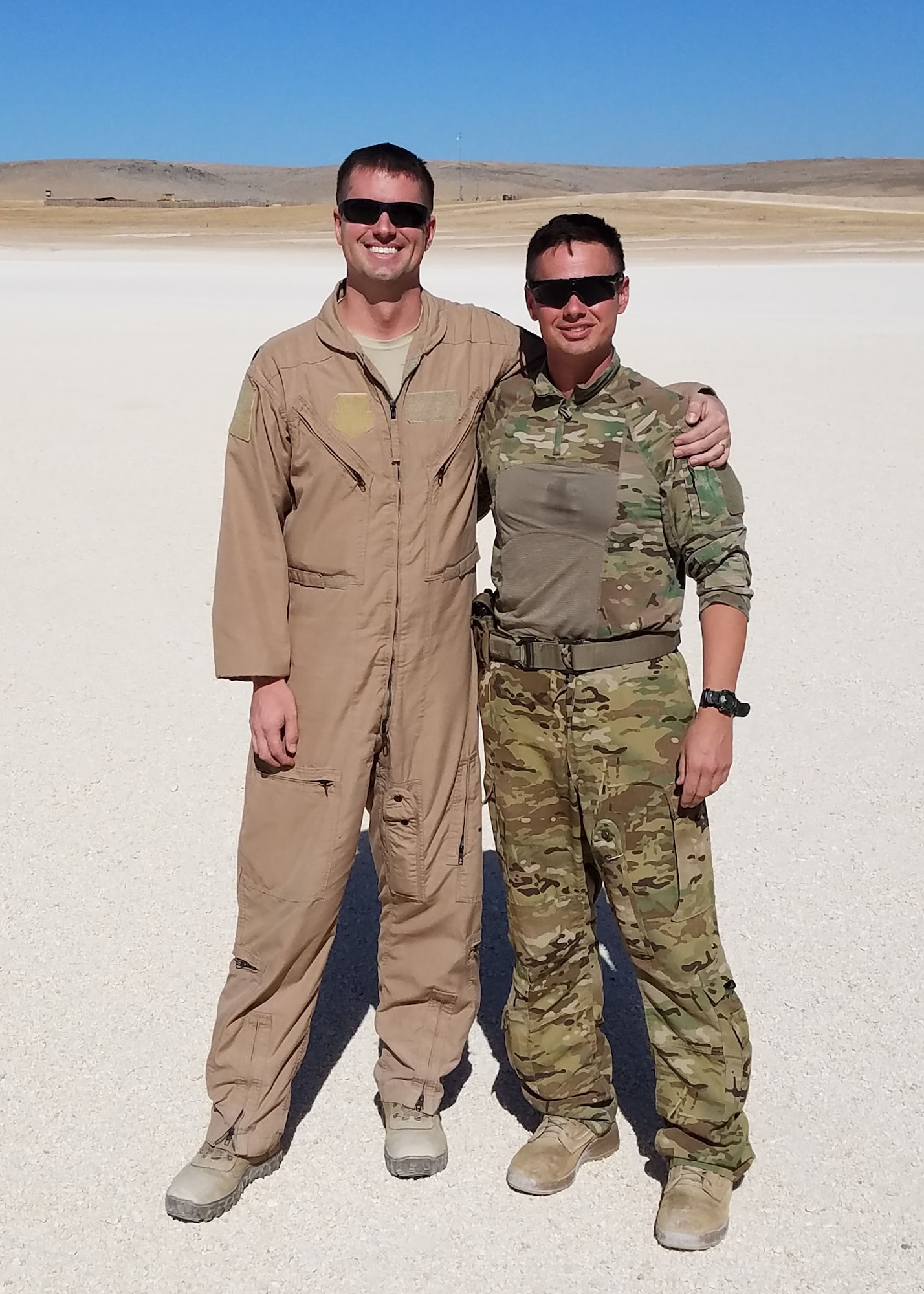 U. S. Air Force Lt. Col. Kevin Roche, 737th Expeditionary Airlift Wing operations director, and U.S. Army Chief Warrant Officer 2 Brian Roche, G Company, 1st Battalion, 189 Aviation Regiment medical evacuation helicopter pilot, found each other at an undisclosed area for approximately three hours to catch up and enjoy each other’s company.