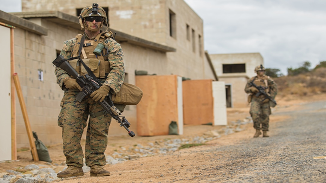 U.S. Marine Corps Lance Cpl. Nathan Long, 7th Engineer Support Battalion, 1st Marine Logistics Group, scouts for enemy contact during a military operations on urban terrain