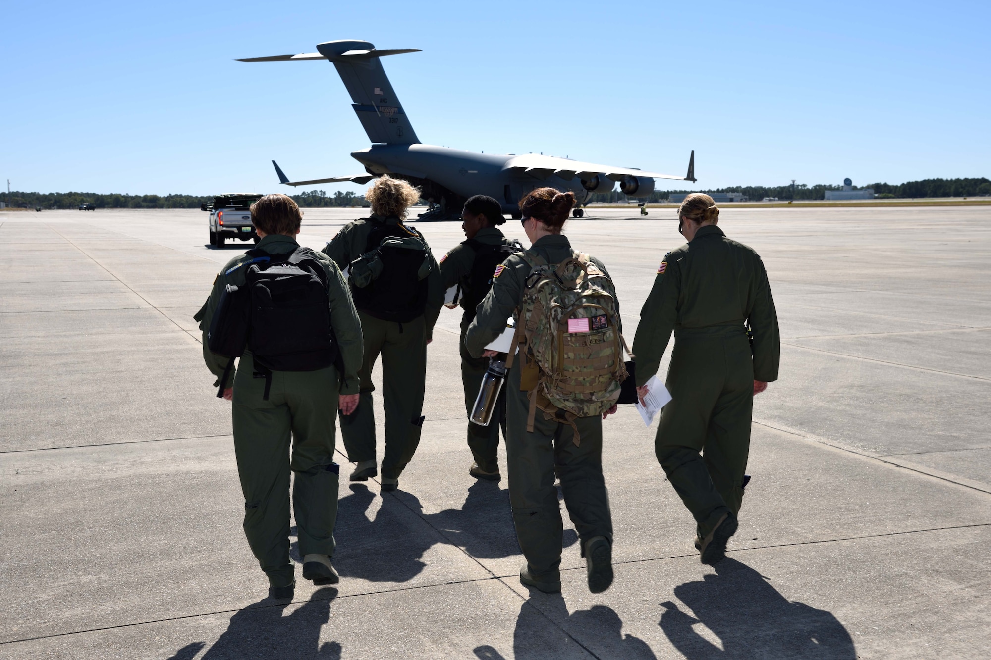 Members of the Air Force Reserve 36th Aeromedical Evacuation Squadron and other Air National Guard AE squadrons head toward a C-17 Globemaster III aircraft from the 183rd Airlift Squadron to prepare it for simulated patient transport Oct. 30, 2017, during Southern Strike 2018 at the Gulfport Combat Readiness Training Center, Mississippi. Southern Strike 2018 is a large-scale, joint multinational combat exercise that provides tactical level training for the full spectrum of conflict and emphasizes air dominance, maritime operations, maritime air support, precision engagement, close air support, command and control, personnel recovery, aeromedical evacuation, and combat medical support. (U.S. Air Force photo by Tech. Sgt. Ryan Labadens)