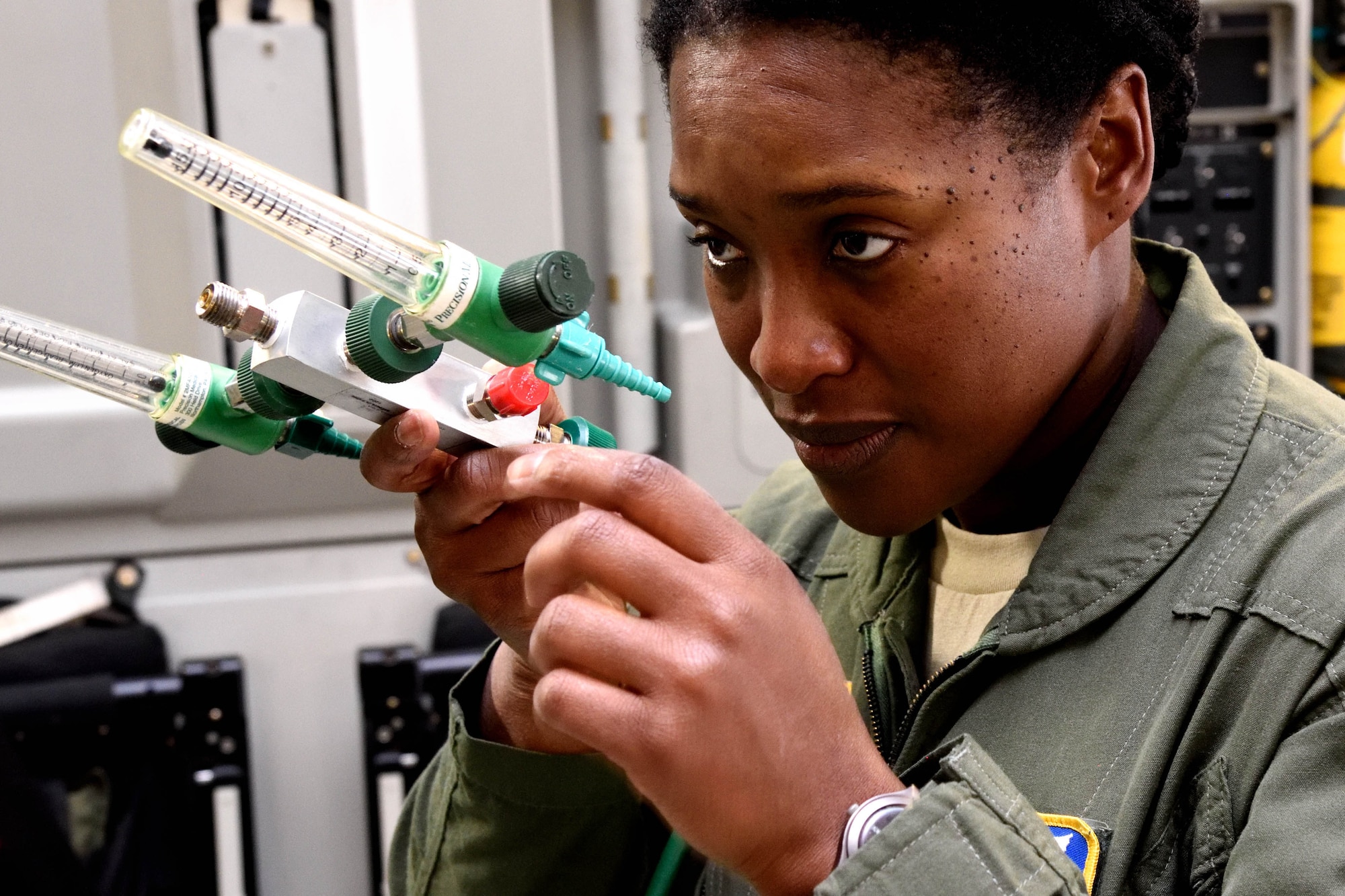 Master Sgt. Kimelyn Hall, 36th Aeromedical Evacuation Squadron aeromedical evacuation technician, inspects a minilator and flowmeter of a portable therapeutic liquid oxygen tank on a C-17 Globemaster III aircraft in preparation for receiving simulated patients during Southern Strike 2018 at the Gulfport Combat Readiness Training Center, Mississippi, Oct. 30, 2017. Southern Strike 2018 is a large-scale, joint multinational combat exercise that provides tactical level training for the full spectrum of conflict and emphasizes air dominance, maritime operations, maritime air support, precision engagement, close air support, command and control, personnel recovery, aeromedical evacuation, and combat medical support. (U.S. Air Force photo by Tech. Sgt. Ryan Labadens)