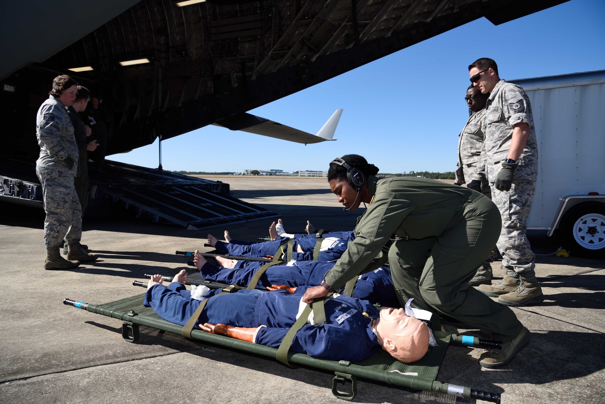 Master Sgt. Kimelyn Hall, 36th Aeromedical Evacuation Squadron aeromedical evacuation technician, ensures simulated patients are secured to their litters before being loaded onto a C-17 Globemaster III aircraft during Southern Strike 2018 at the Gulfport Combat Readiness Training Center, Mississippi, Oct. 30, 2017. Southern Strike 2018 is a large-scale, joint multinational combat exercise that provides tactical level training for the full spectrum of conflict and emphasizes air dominance, maritime operations, maritime air support, precision engagement, close air support, command and control, personnel recovery, aeromedical evacuation, and combat medical support. (U.S. Air Force photo by Tech. Sgt. Ryan Labadens)