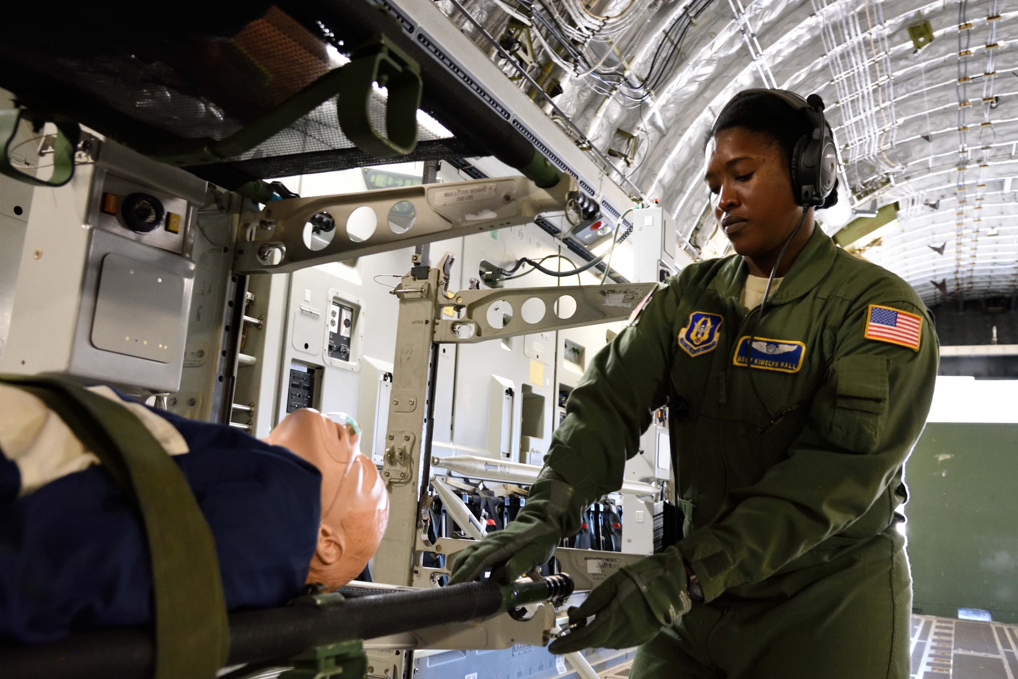 Master Sgt. Kimelyn Hall, 36th Aeromedical Evacuation Squadron aeromedical evacuation technician, secures a litter to a litter stanchion on board a C-17 Globemaster III aircraft during Southern Strike 2018 at the Gulfport Combat Readiness Training Center, Mississippi, Oct. 30, 2017. Southern Strike 2018 is a large-scale, joint multinational combat exercise that provides tactical level training for the full spectrum of conflict and emphasizes air dominance, maritime operations, maritime air support, precision engagement, close air support, command and control, personnel recovery, aeromedical evacuation, and combat medical support. (U.S. Air Force photo by Tech. Sgt. Ryan Labadens)