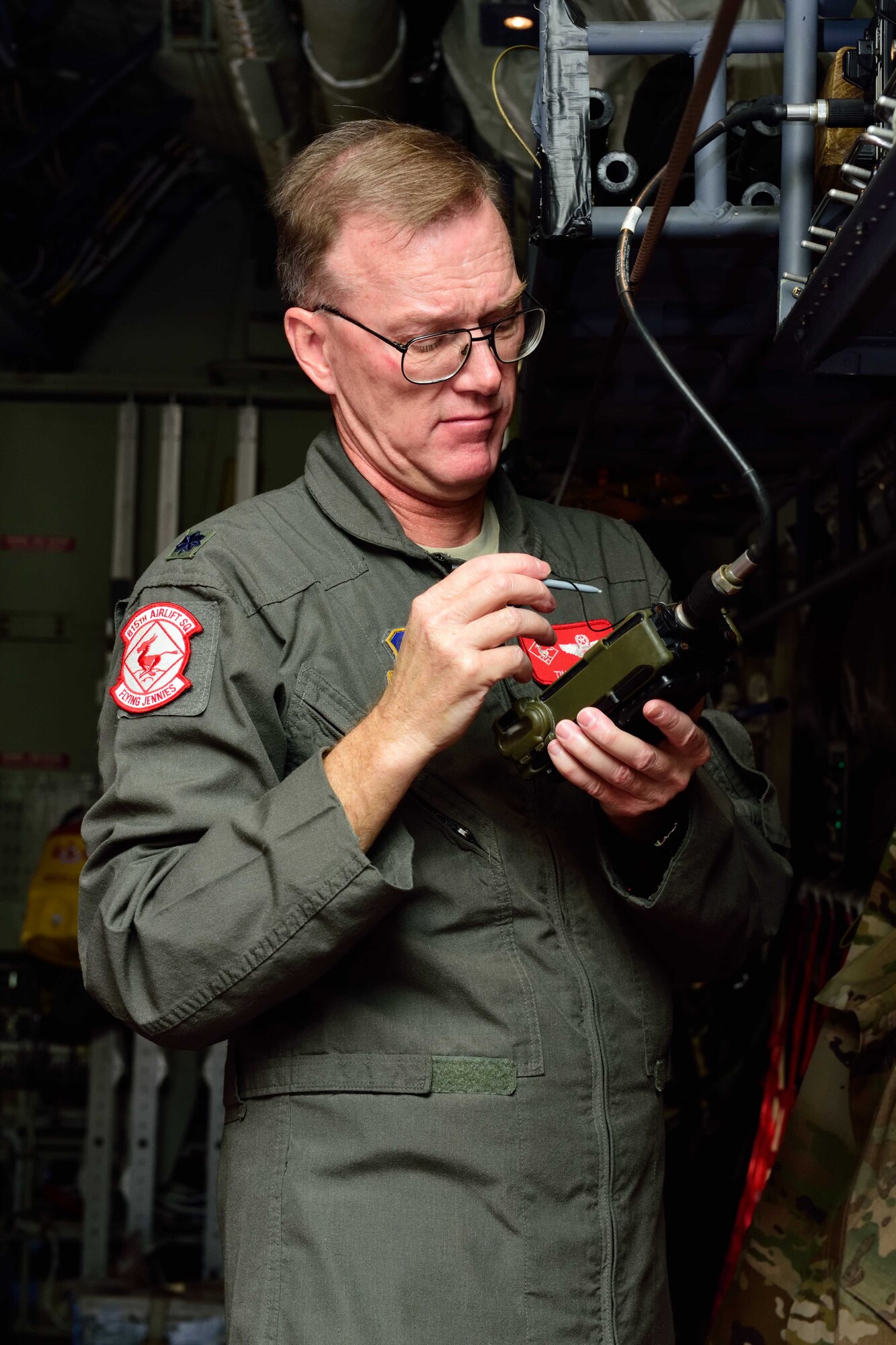 Lt. Col. Timothy Weiher, 815th Airlift Squadron assistant director of operations, tests a simple key loader communications security device on a C-130 Super Hercules aircraft at Keesler Air Force Base, Mississippi, in preparation for an aeromedical evacuation exercise Nov. 1, 2017, during Southern Strike 2018. Southern Strike 2018 is a large-scale, joint multinational combat exercise that provides tactical level training for the full spectrum of conflict and emphasizes air dominance, maritime operations, maritime air support, precision engagement, close air support, command and control, personnel recovery, aeromedical evacuation, and combat medical support. (U.S. Air Force photo by Tech. Sgt. Ryan Labadens)