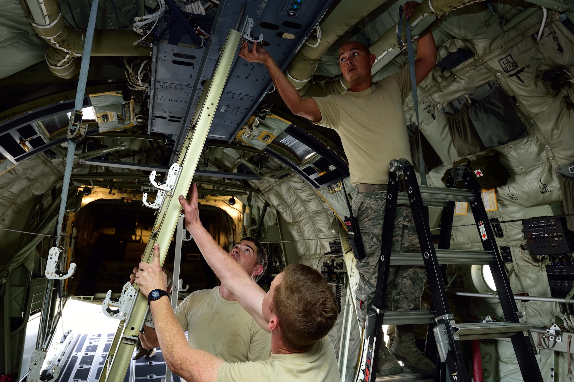 Crew chiefs from the 803rd Aircraft Maintenance Squadron install litter stanchions on a C-130 Super Hercules aircraft at Keesler Air Force Base, Mississippi, in preparation for an aeromedical evacuation exercise Nov. 1, 2017, during Southern Strike 2018. Southern Strike 2018 is a large-scale, joint multinational combat exercise that provides tactical level training for the full spectrum of conflict and emphasizes air dominance, maritime operations, maritime air support, precision engagement, close air support, command and control, personnel recovery, aeromedical evacuation, and combat medical support. (U.S. Air Force photo by Tech. Sgt. Ryan Labadens)