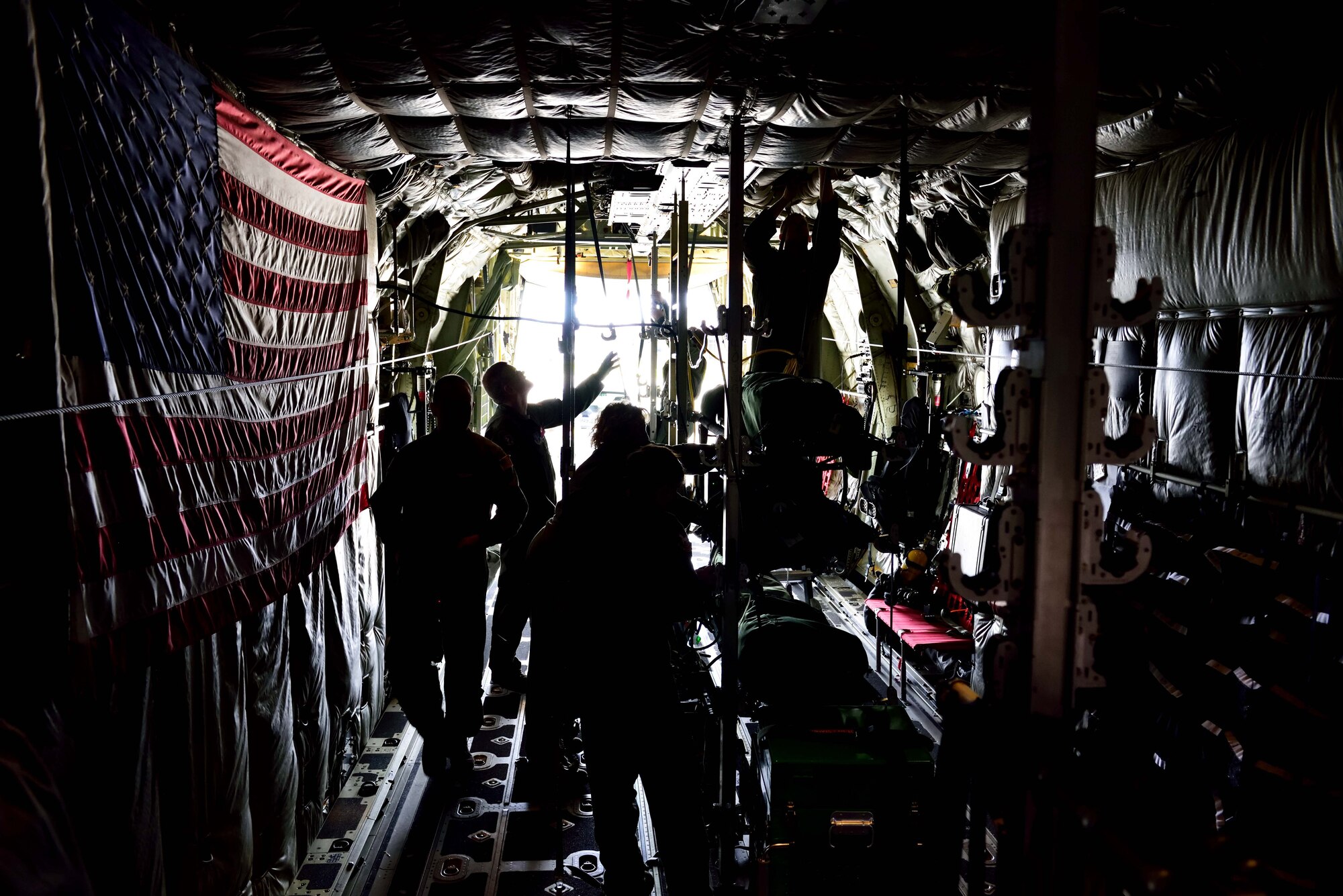 Members from various aeromedical evacuation squadrons set up their medical equipment on an 815th Airlift Squadron C-130 Super Hercules aircraft at the Gulfport Combat Readiness Training Center, Mississippi, in preparation for an aeromedical evacuation exercise Nov. 1, 2017, during Southern Strike 2018. Southern Strike 2018 is a large-scale, joint multinational combat exercise that provides tactical level training for the full spectrum of conflict and emphasizes air dominance, maritime operations, maritime air support, precision engagement, close air support, command and control, personnel recovery, aeromedical evacuation, and combat medical support. (U.S. Air Force photo by Tech. Sgt. Ryan Labadens)