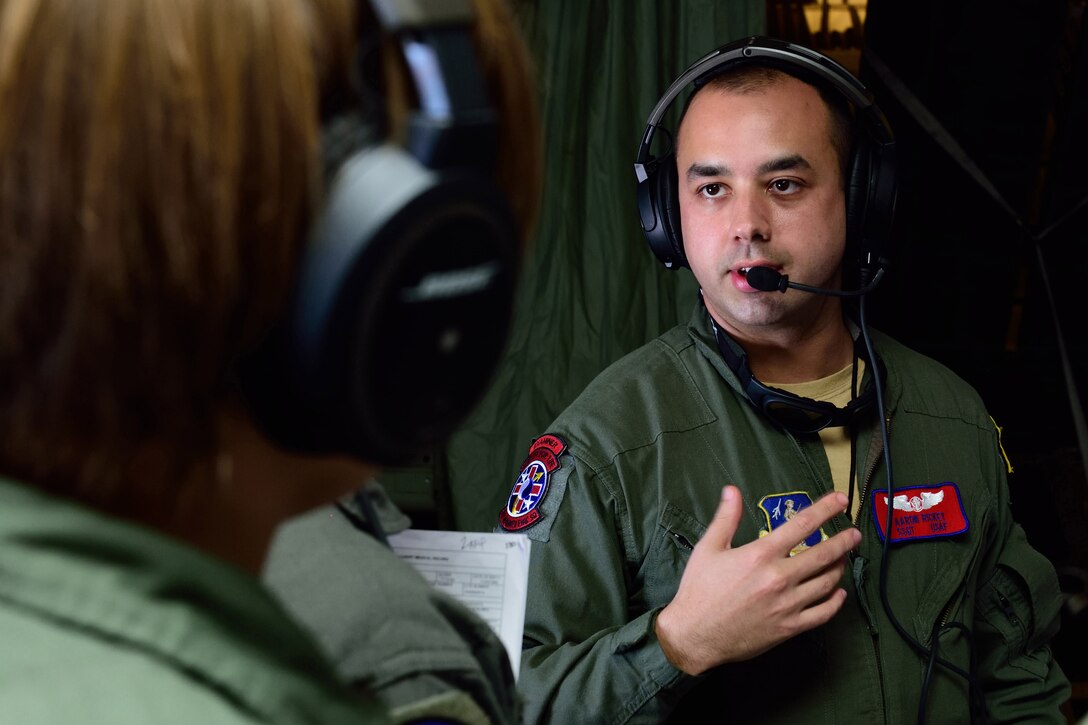 Staff Sgt. Aaron Rickey, a 137th Aeromedical Evacuation Squadron examiner from the Will Rogers Air National Guard Base, Oklahoma, discusses a simulated in-flight patient emergency with other AE crew members on an 815th Airlift Squadron C-130 Super Hercules aircraft during an aeromedical evacuation exercise Nov. 1, 2017, for Southern Strike 2018. Southern Strike 2018 is a large-scale, joint multinational combat exercise that provides tactical level training for the full spectrum of conflict and emphasizes air dominance, maritime operations, maritime air support, precision engagement, close air support, command and control, personnel recovery, aeromedical evacuation, and combat medical support. (U.S. Air Force photo by Tech. Sgt. Ryan Labadens)