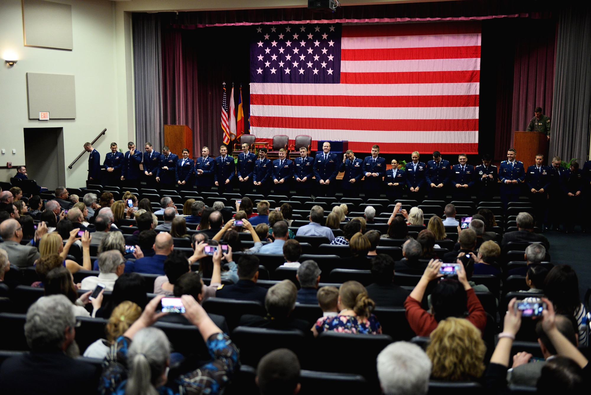 Graduates of Specialized Undergraduate Pilot Training Class 18-01 break their first set of wings Oct. 27, 2017, on Columbus Air Force Base, Mississippi. The breaking of the wings symbolizes good luck for an Air Force pilot, and upon their death the two halves will be brought back together to commemorate their service as a professional military aviator. (U.S. Air Force photo by Airman 1st Class Keith Holcomb)
