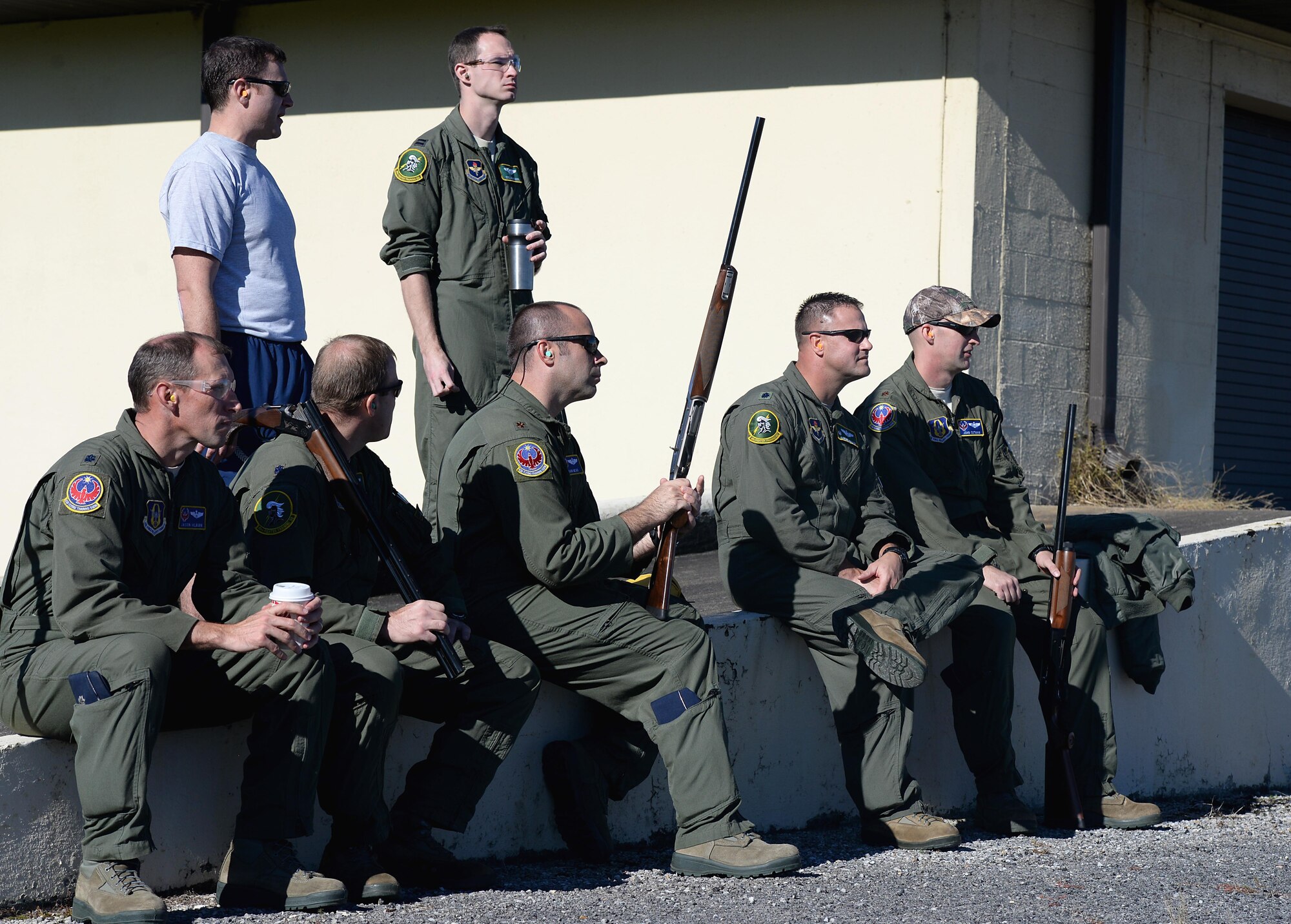 Officers competing in the turkey shoot event watch other individuals shoot clay pigeons Oct. 26, 2017, on Columbus Air Force Base, Mississippi. Instructor pilots from each flying training squadron competed in multiple events while simultaneously meeting several continuation training requirements. (U.S. Air Force photo by Airman 1st Class Keith Holcomb)