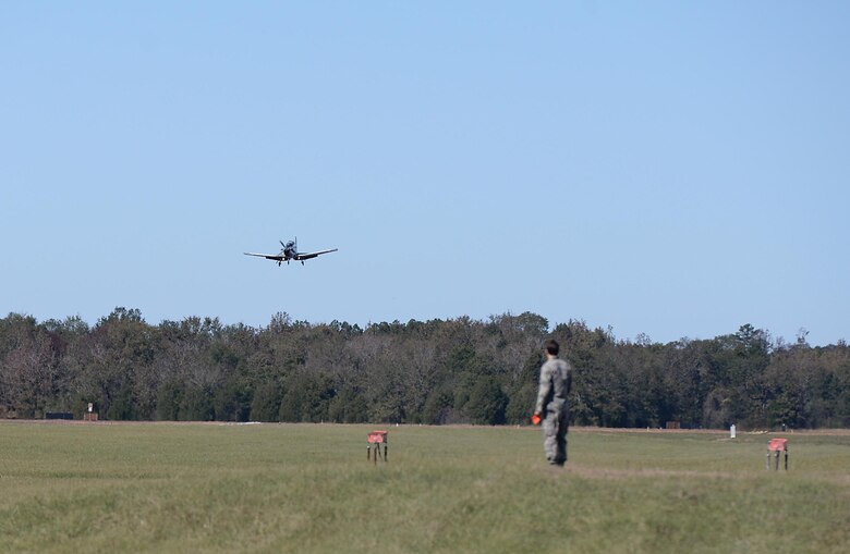 Second Lt. Daniel Caddigan, 14th Student Squadron student pilot, waits for a T-6A Texan II to land during the turkey shoot event Oct. 26, 2017, on Columbus Air Force Base, Mississippi. Caddigan was responsible for marking spots where the aircraft first touched down to help score how well the landing was performed. (U.S. Air Force photo by Airman 1st Class Keith Holcomb)