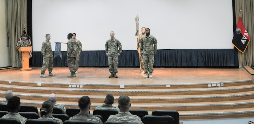 Soldiers conduct a transfer of authority ceremony.