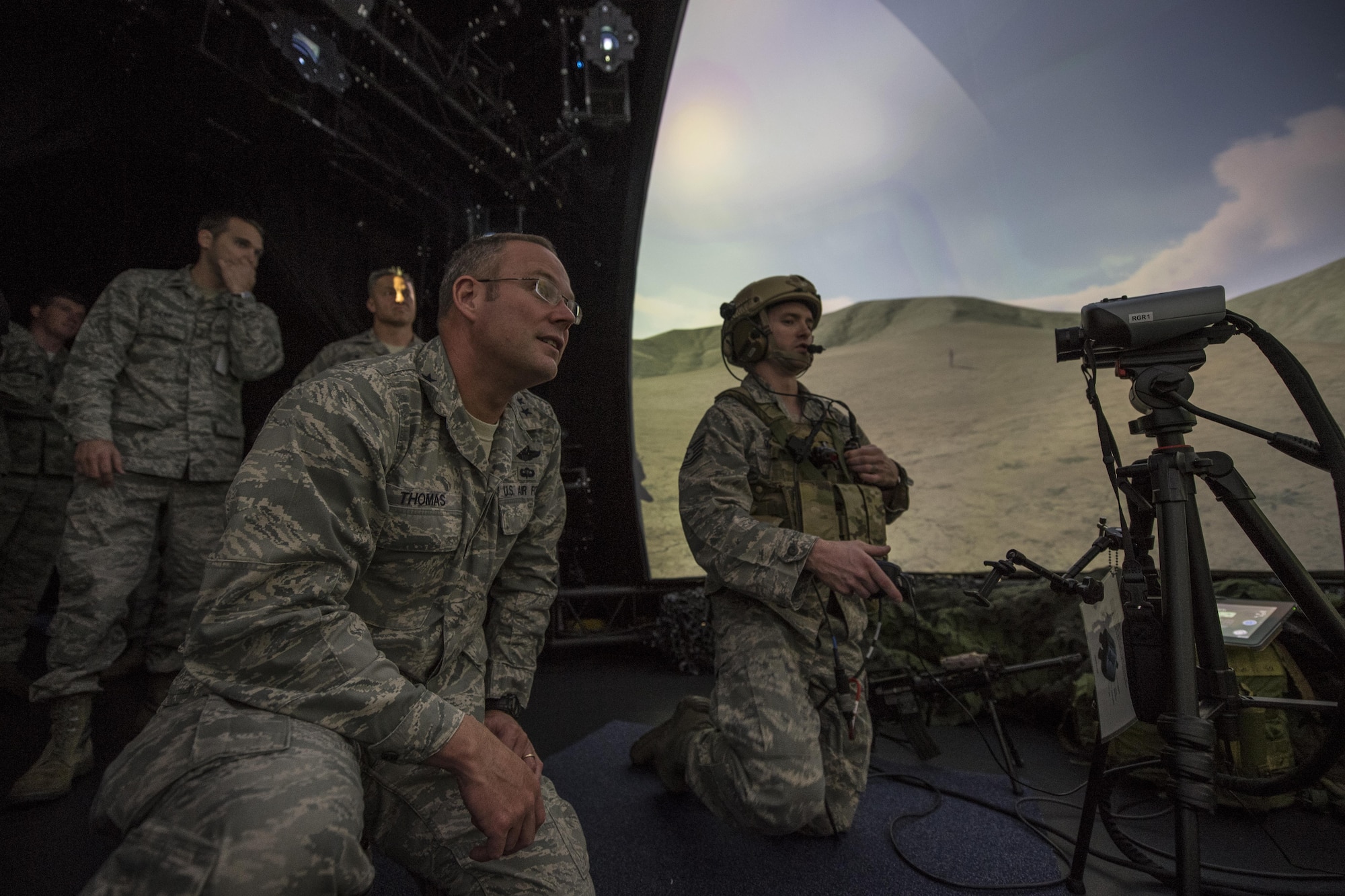 U.S. Air Force Maj. Gen. Jon T. Thomas, Headquarters United States Air Forces in Europe and Air Forces Africa Operations, Strategic Deterrence and Nuclear Integration director, observes U.S. Air Force Tech. Sgt. John Oregan, USAFE Warrior Preparation Center Air Ground Operations School Joint Terminal Attack Controller instructor, as he runs a simulation using the Joint Terminal Control Training and Rehearsal System at the WPC at Einsiedlerhof Air Station, Germany, Nov. 2, 2017. Thomas visited the WPC to participate in the ribbon cutting event for the new domed simulator. (U.S. Air Force photo by Senior Airman Devin Boyer)