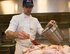 Carsten Mueller, 786th Force Support Squadron Rheinland Inn lead cook, prepares chicken for the dining facility lunch on Ramstein Air Base, Germany, Nov. 3, 2017. The inn follows the standardized Air Force menu, which runs on a 21 day rotation. Every recipe is prepared in a standardized manner to provide maximum nutrition. (U.S. Air Force photo by Senior Airman Elizabeth Baker)