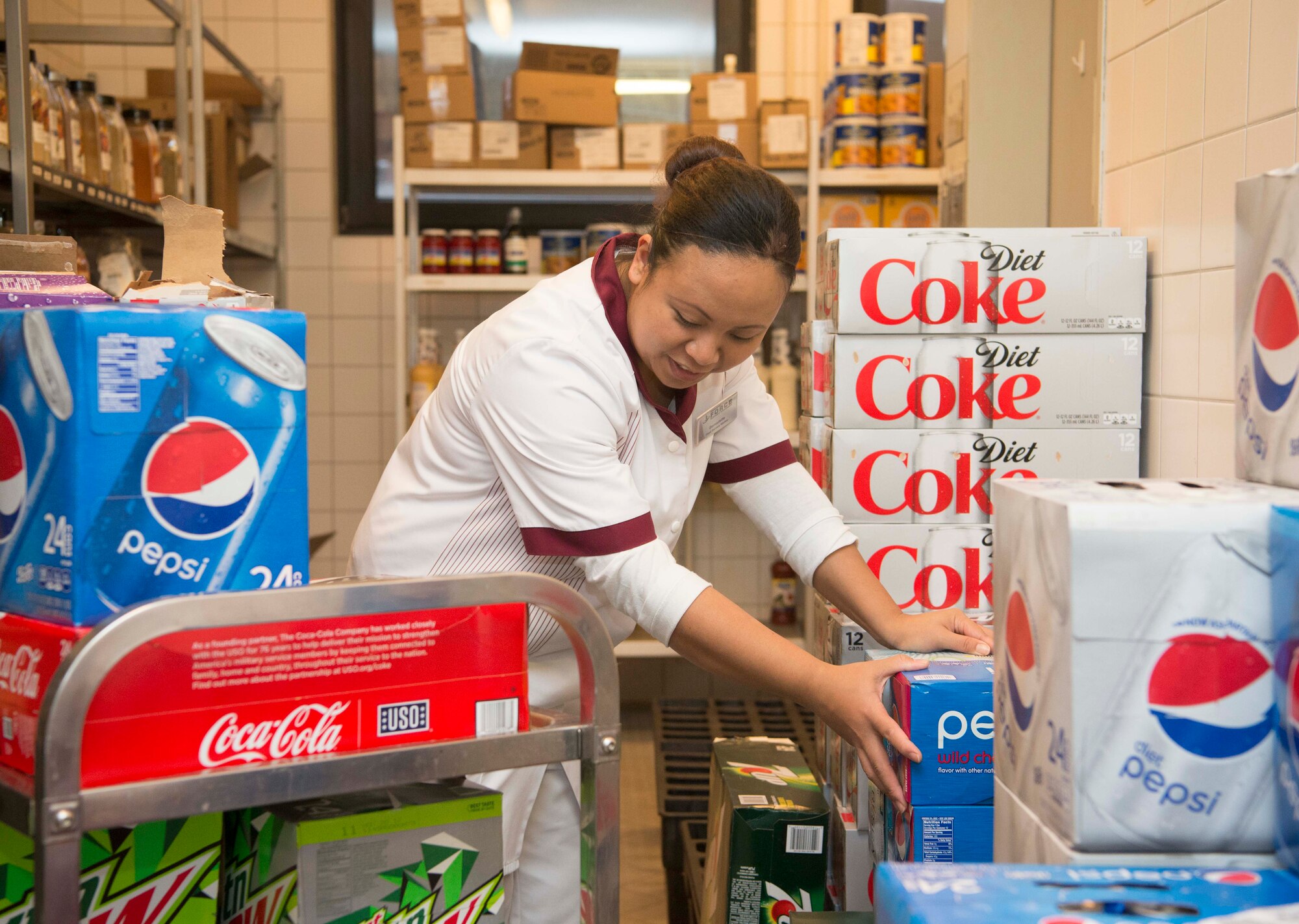 Bernadette Hamedou, 786th Force Support Squadron Rheinland Inn food service worker, arranges beverage boxes on Ramstein Air Base, Germany, Nov. 3, 2017. The Rheinland Inn offers a wide variety of beverages, entrees and snacks. (U.S. Air Force photo by Senior Airman Elizabeth Baker)