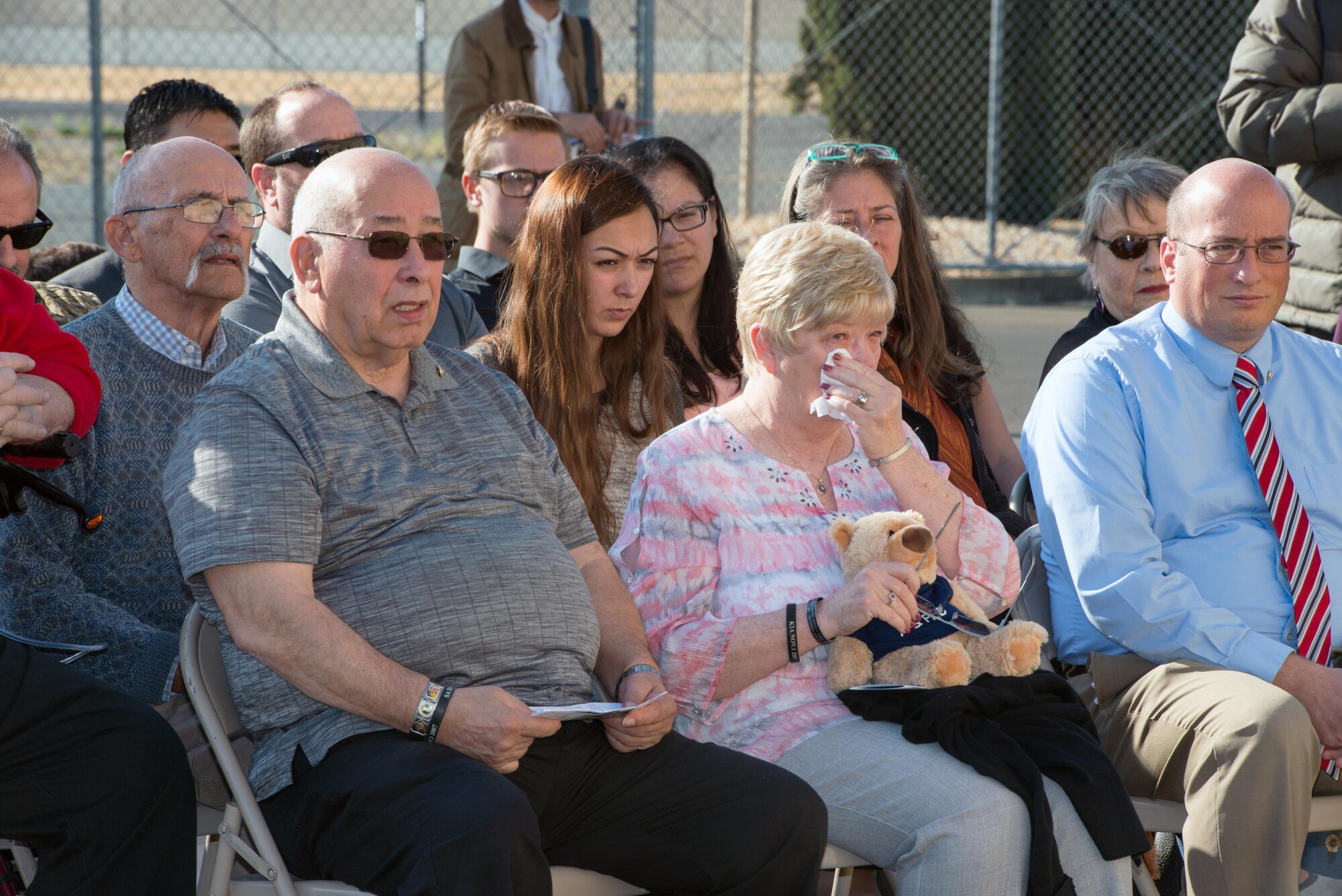 Loreene Wieger, mother of OSI agent David Wieger weeps during a ceremony honoring her Son at Travis Air Force Base, Calif., Nov. 1, 2017. David Wieger was killed in 2007 when an improvised explosive device struck his vehicle during his deployment in support of Operation Iraqi Freedom. The Office of Special Investigation, 12th Field Investigation Squadron, unveiled the renaming of their building to the fallen OSI agent. Wieger was stationed at Travis at the time and was posthumously awarded the Bronze Star, Purple Heart, AF Commendation Medal, and AF Combat Action Medal. (U.S. Air Force photo by Louis Briscese)