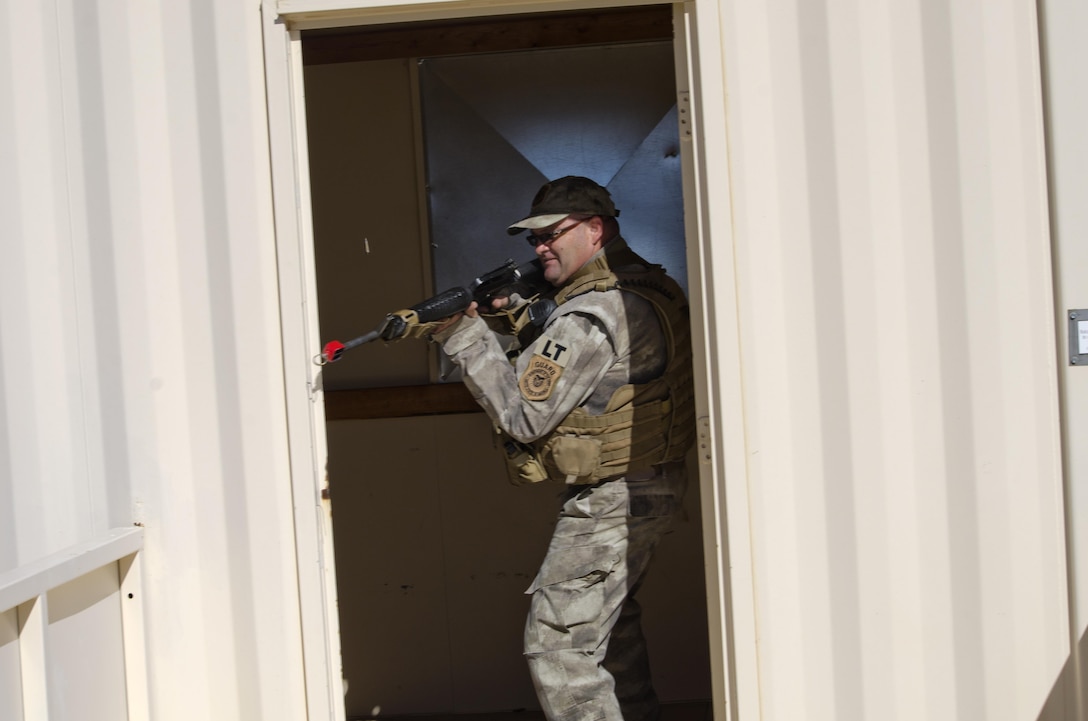 Security guard fires a rifle.