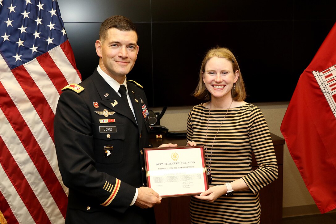 Lt. Col. Cullen Jones, U.S. Army Corps of Engineers Nashville District commander, presents a certificate of appreciation to Constance Burkhart during a promotion ceremony for her husband Lt. Col. Christopher Burkhart, deputy commander, in Nashville, Tenn., Nov. 2, 2017. (USACE photo by Mark Abernathy)
