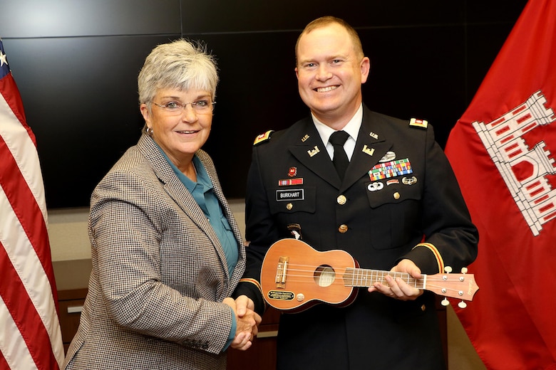 Patty Coffey, U.S. Army Corps of Engineers Nashville District engineer, presents a ukulele, a symbol of Music City, to Lt. Col. Christopher Burkhart, deputy commander, during a farewell ceremony at the district headquarters in Nashville, Tenn., Nov. 2, 2017. (USACE photo by Mark Abernathy)