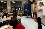 Dr. Stefanie Shiels, a staff scientist at the at the U.S. Army Institute of Surgical Research at Joint Base San Antonio-Fort Sam Houston, recreates an elbow joint from PVC pipe, rubber bands, string and balloons Oct. 4 at St. Matthew Catholic School during a community outreach event.