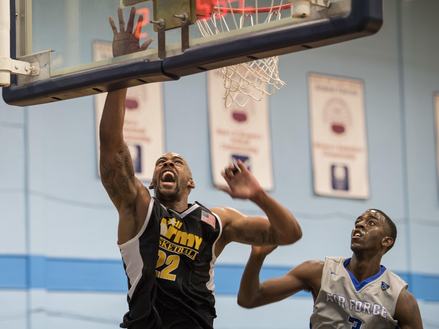 SAN ANTONIO (Nov. 02, 2017) - U.S. Army Spc. Derell Henderson, assigned to Fort Carson, Colo. attempts to score a layup during a basketball game. The 2017 Armed Forces Basketball Championship is held at Joint Base San Antonio, Lackland Air Force Base from 1-7 November. The best two teams during the double round robin will face each other for the 2017 Armed Forces crown. (U.S. Navy photo by Mass Communication Specialist 2nd Class Emiline L. M. Senn/Released)