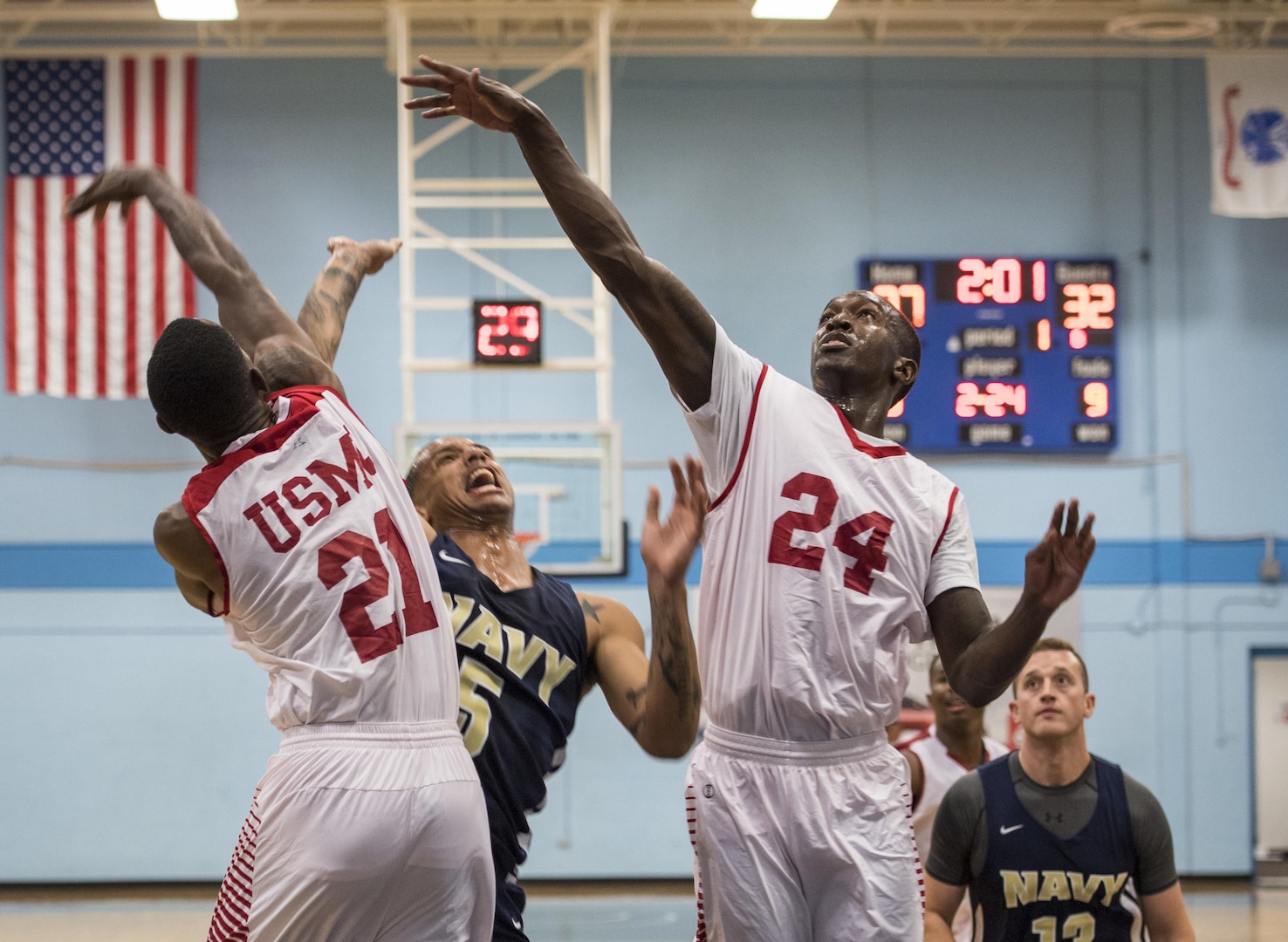 SAN ANTONIO (Nov. 02, 2017) - Members of the U.S. Marine Corps men's basketball team block U.S. Navy Petty Officer Marquel Delancey's shot during a basketball game. The 2017 Armed Forces Basketball Championship is held at Joint Base San Antonio, Lackland Air Force Base from 1-7 November. The best two teams during the double round robin will face each other for the 2017 Armed Forces crown. (U.S. Navy photo by Mass Communication Specialist 2nd Class Emiline L. M. Senn/Released)
