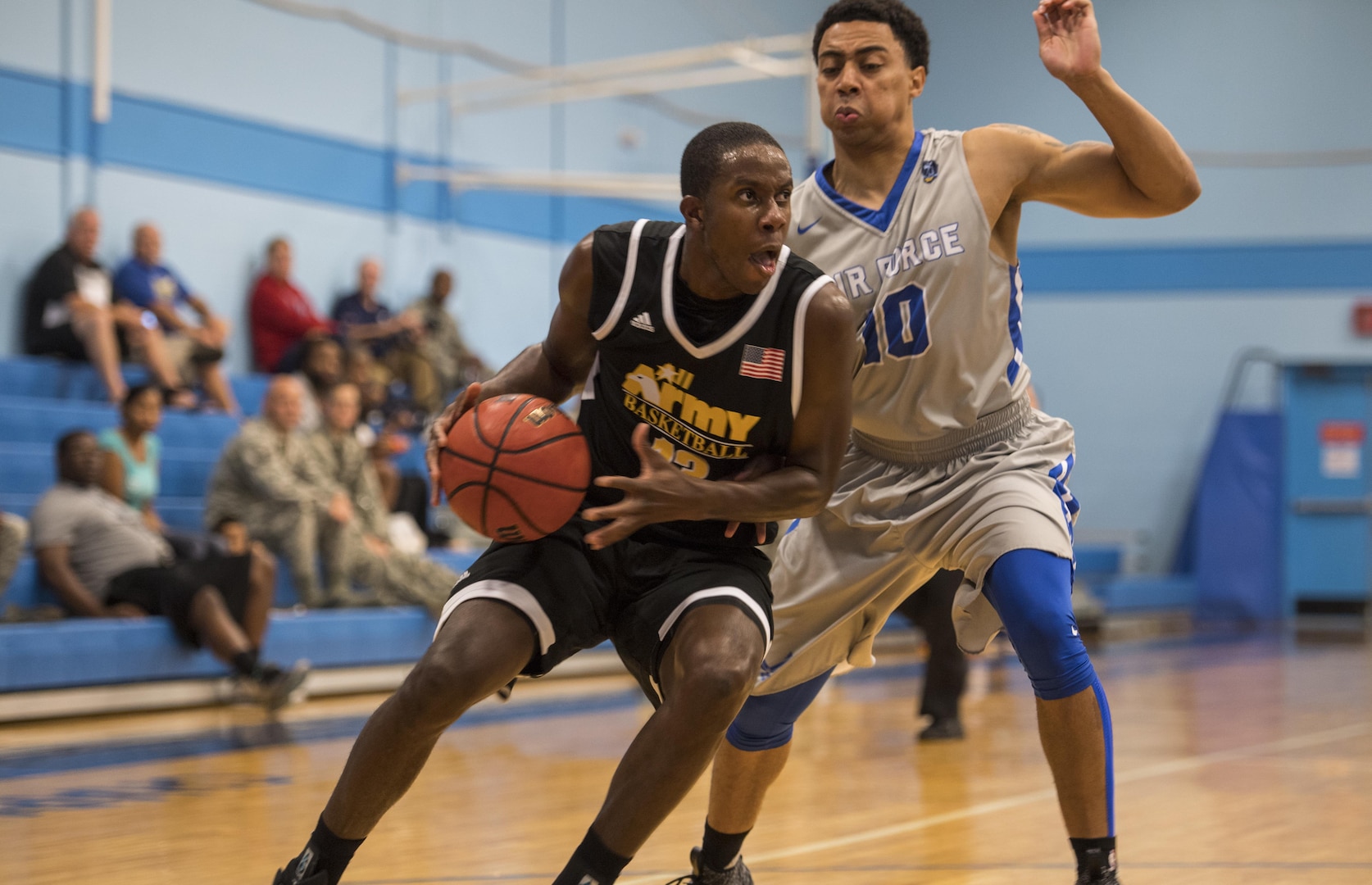 SAN ANTONIO (Nov. 02, 2017) - U.S. Army Capt. Ella Ellis, assigned to Fort Sill, Okla. attempts to drive the ball down the court during a basketball game. The 2017 Armed Forces Basketball Championship is held at Joint Base San Antonio, Lackland Air Force Base from 1-7 November. The best two teams during the double round robin will face each other for the 2017 Armed Forces crown. (U.S. Navy photo by Mass Communication Specialist 2nd Class Emiline L. M. Senn/Released)