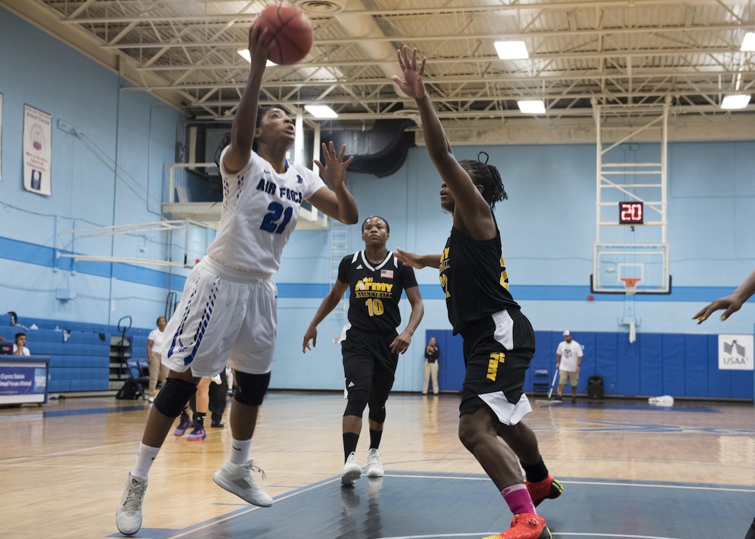 SAN ANTONIO (Nov. 02, 2017) - U.S. Air Force Airman 1st Class Apiphany Woods, assigned to Moody AFB, attempts a layup during a basketball game. The 2017 Armed Forces Basketball Championship is held at Joint Base San Antonio, Lackland Air Force Base from 1-7 November. The best two teams during the double round robin will face each other for the 2017 Armed Forces crown. (U.S. Navy photo by Mass Communication Specialist 2nd Class Christopher Frost/Released)