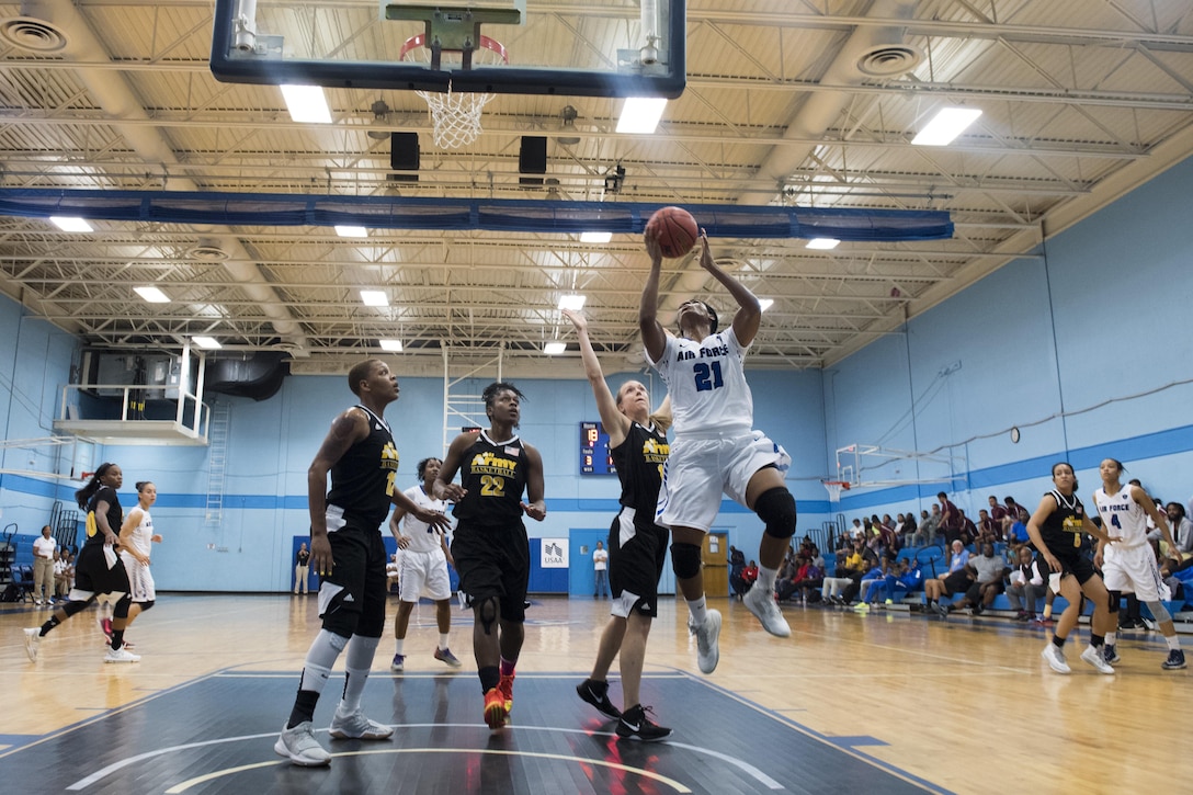 SAN ANTONIO (Nov. 02, 2017) - U.S. Air Force Airman 1st Class Apiphany Woods, assigned to Moody AFB, attempts a layup during a basketball game. The 2017 Armed Forces Basketball Championship is held at Joint Base San Antonio, Lackland Air Force Base from 1-7 November. The best two teams during the double round robin will face each other for the 2017 Armed Forces crown. (U.S. Navy photo by Mass Communication Specialist 2nd Class Christopher Frost/Released)