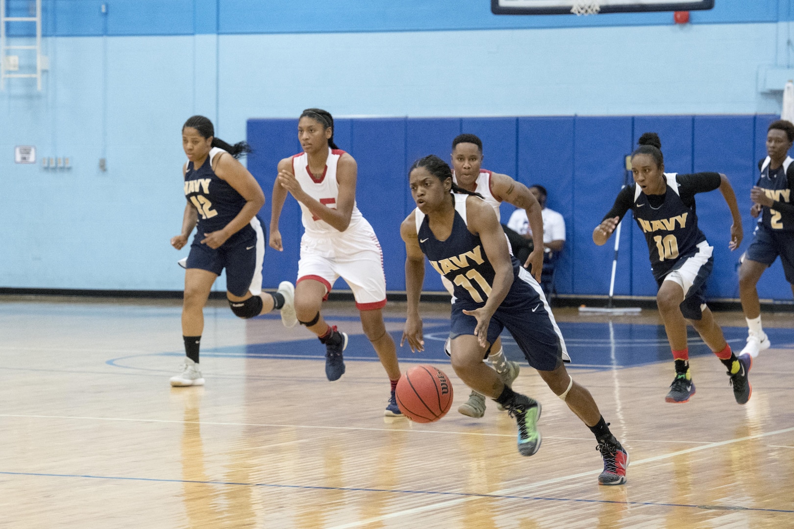 SAN ANTONIO (Nov. 02, 2017) - U.S. Navy Seaman Yasmene Harris, assigned to USS Eisenhower (CVN 69), dribbles down the court during a basketball game. The 2017 Armed Forces Basketball Championship is held at Joint Base San Antonio, Lackland Air Force Base from 1-7 November. The best two teams during the double round robin will face each other for the 2017 Armed Forces crown. (U.S. Navy photo by Mass Communication Specialist 2nd Class Christopher Frost/Released)