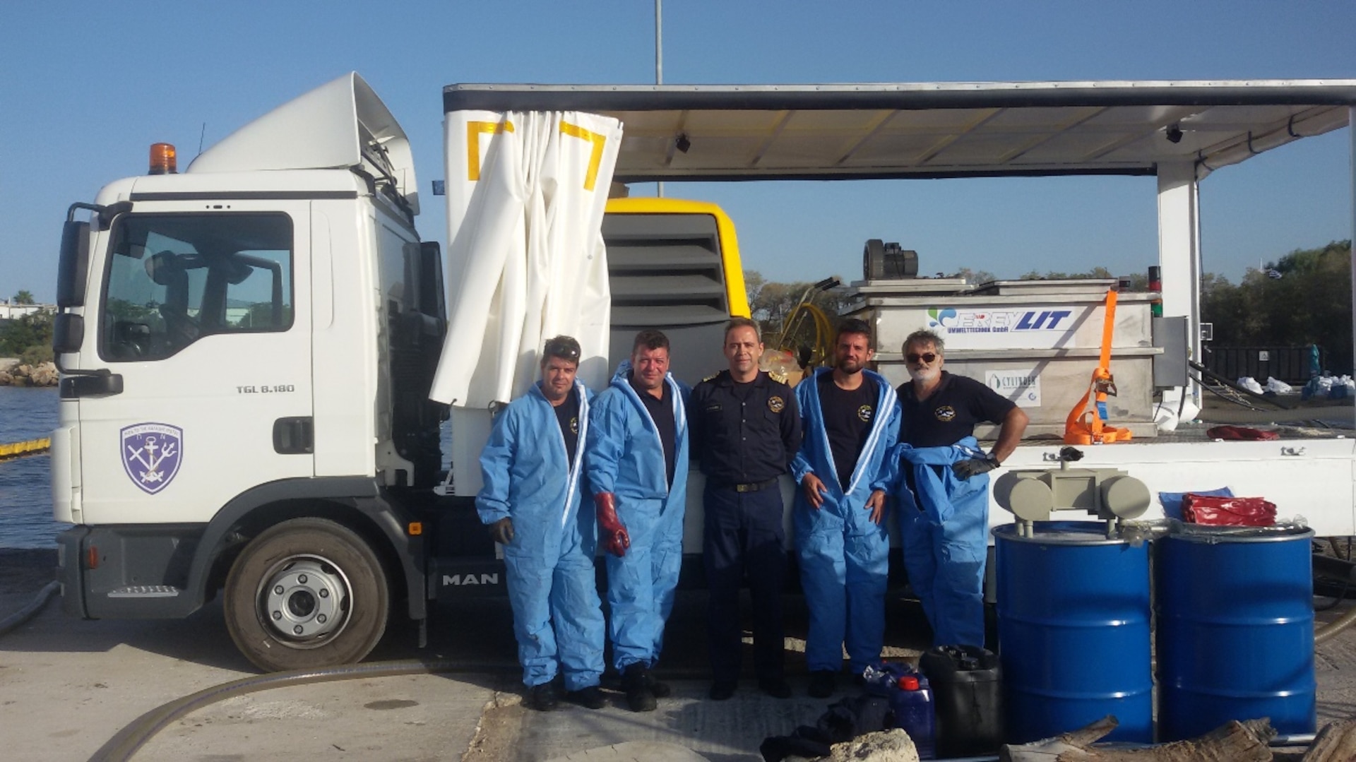 Oil spill clean-up team members