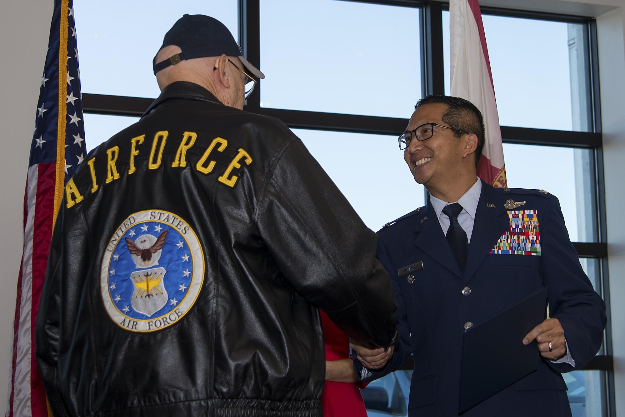 U.S. Air Force Col. Troy Pananon, the 6th Air Mobility Wing vice commander, shakes the hand of a Vietnam veteran Oct. 30, 2017, during the Vietnam Veterans Commemoration event held at the Bryan Glazier Family Jewish Community Center in Tampa, Fla. The veterans received a service lapel as well as a certificate to honor and highlight their service during the Vietnam War.