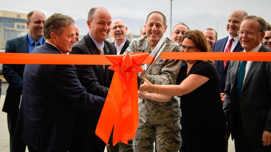 (Left to right) Utah state Sen. Jerry Stevenson, Utah Lt. Gov. Spencer Cox, Lt. Gen. Lee K. Levy II, Air Force Sustainment Center commander, and Dr. Ivy Estabrook, USTAR executive director, cut the ribbon to the newly constructed USTAR Innovation Center located just outside the west gate of Hill Air Force Base, Utah, Nov. 3, 2017. (U.S. Air Force photo by R. Nial Bradshaw)