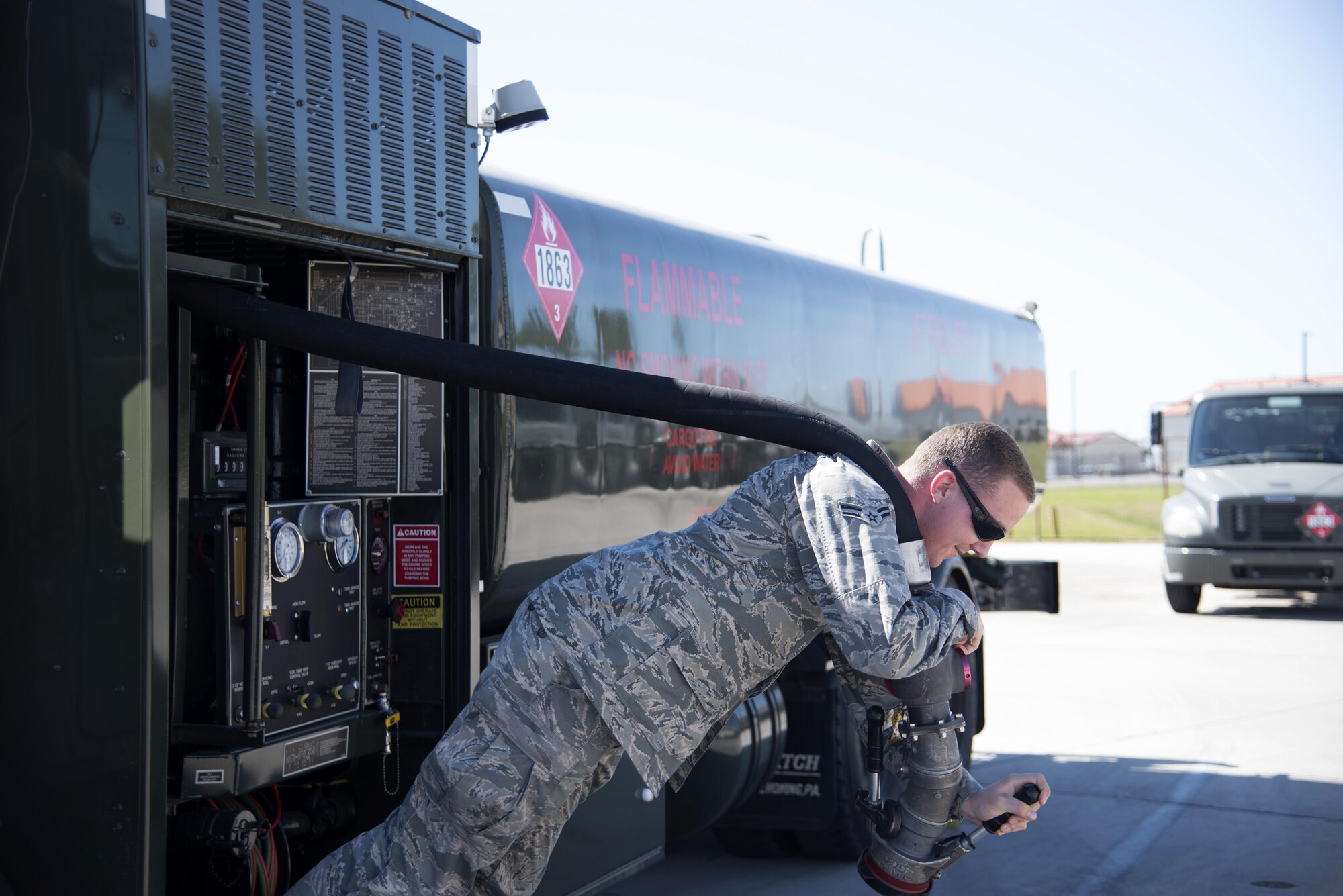 U.S. Air Force Airman 1st Class Ryan Souther, a fuels distribution operator assigned to the 6th Logistics Readiness Squadron, pulls the hose out of a refueling truck at MacDill Air Force Base Fla., Nov. 2, 2017.
