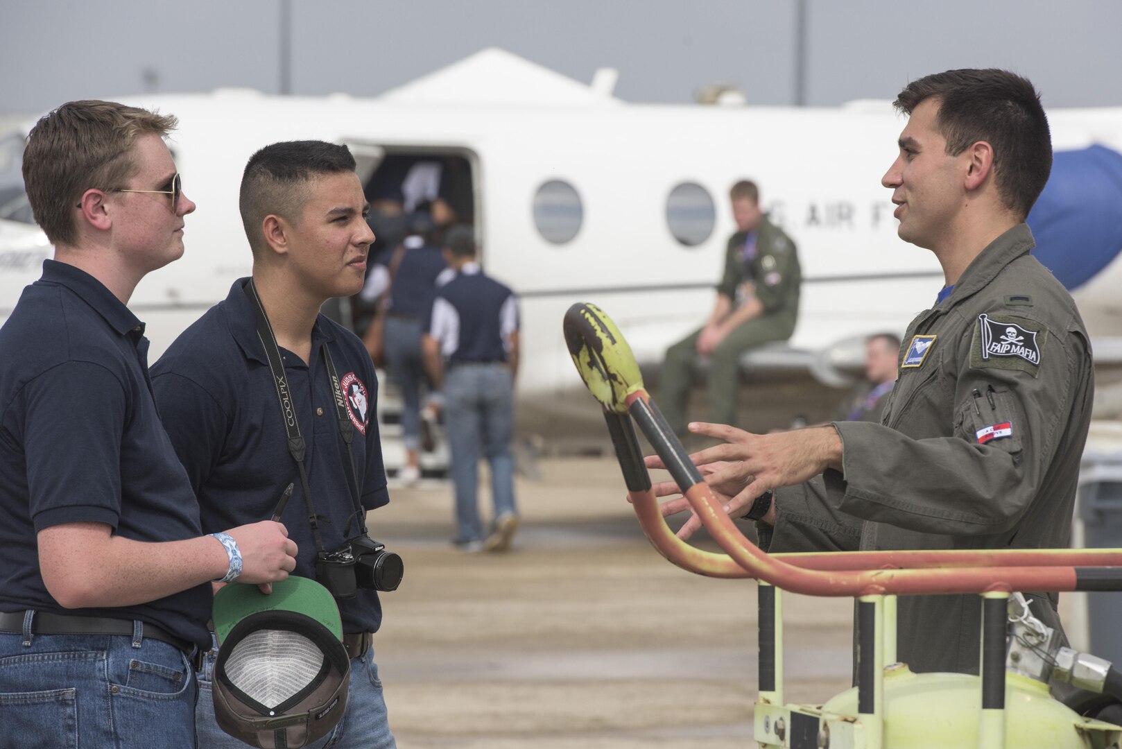 Junior Reserve Officers’ Corps cadets speak to a pilot from the 12th Flying Training Wing Nov. 3, 2017, during the 2017 Joint Base San Antonio Air Show and Open House at JBSA-Lackland, Kelly Field, Texas. The Junior Reserve Officer Training Corps is a federal program sponsored by the United States Armed Forces in high schools and also in some middle schools across the United States and United States military bases across the world. (U.S. Air Force photo by Senior Airman Stormy Archer)