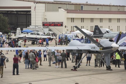 Visitors take in the sights and sound of the 2017 Joint Base San Antonio Air Show and Open House Nov. 4, 2017, at JBSA-Lackland, Kelly Field, Texas. Air shows allow the Air Force to display the capabilities of our aircraft to the American taxpayer through aerial demonstrations and static displays. (U.S. Air Force photo by Senior Airman Stormy Archer)