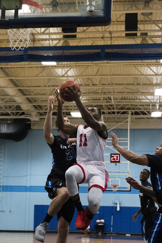 SAN ANTONIO (Nov. 03, 2017) -U.S. Marine Corps Cpl. Bryan Bastiste, assigned to Marine Corps Base Camp Pendleton, attempts a layup during a basketball game. The 2017 Armed Forces Basketball Championship is held at Joint Base San Antonio, Lackland Air Force Base from 1-7 November. The best two teams during the double round robin will face each other for the 2017 Armed Forces crown. (U.S. Navy photo by Mass Communication Specialist 2nd Class Christopher Frost/Released)