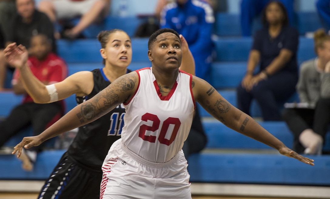SAN ANTONIO (Nov. 03, 2017) - U.S. Marine Corps Ssgt. Sha Ronda Jones, assigned to Marine Corps Base Camp Lejeune eyes a rebound  during a basketball game. The 2017 Armed Forces Basketball Championship is held at Joint Base San Antonio, Lackland Air Force Base from 1-7 November. The best two teams during the double round robin will face each other for the 2017 Armed Forces crown. (U.S. Navy photo by Mass Communication Specialist 2nd Class Emiline L. M. Senn/Released)