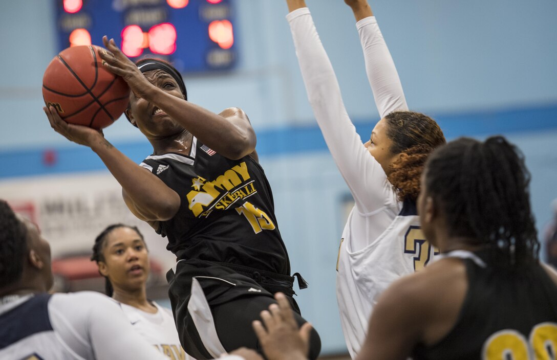 SAN ANTONIO (Nov. 03, 2017) - U.S. Army 2nd Lt. Kiana Doliveira, assigned to Fort Carson, Colo., attempts to score during a basketball game. The 2017 Armed Forces Basketball Championship is held at Joint Base San Antonio, Lackland Air Force Base from 1-7 November. The best two teams during the double round robin will face each other for the 2017 Armed Forces crown. (U.S. Navy photo by Mass Communication Specialist 2nd Class Emiline L. M. Senn/Released)