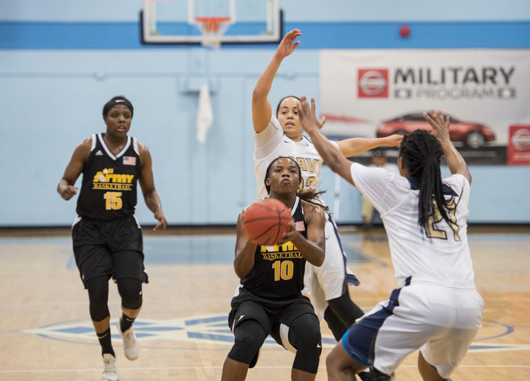 SAN ANTONIO (Nov. 03, 2017) - U.S. Army Sgt. Donita Adams, assigned to the Md. Army National Guard attempts to score during a basketball game. The 2017 Armed Forces Basketball Championship is held at Joint Base San Antonio, Lackland Air Force Base from 1-7 November. The best two teams during the double round robin will face each other for the 2017 Armed Forces crown. (U.S. Navy photo by Mass Communication Specialist 2nd Class Emiline L. M. Senn/Released)