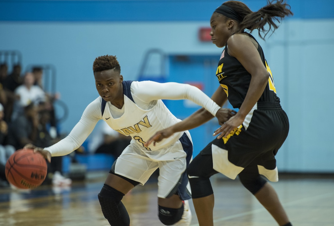 SAN ANTONIO (Nov. 03, 2017) - U.S. Navy Petty Officer 2nd Class Shynisha Johnson, assigned to the amphibious transport dock USS New Orleans (LPD 18), drives the ball during a basketball game. The 2017 Armed Forces Basketball Championship is held at Joint Base San Antonio, Lackland Air Force Base from 1-7 November. The best two teams during the double round robin will face each other for the 2017 Armed Forces crown. (U.S. Navy photo by Mass Communication Specialist 2nd Class Emiline L. M. Senn/Released)