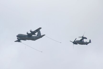 An MC-130J Super Hercules aircraft conducts a CV-22 aircraft Tilt-Rotor Air-to-Air Refueling demonstration during the 2017 Joint Base San Antonio Air Show and Open House Nov. 4, at JBSA-Lackland, Kelly Field Annex.  Air shows allow the U.S. military and civilian demonstration teams to display their capabilities through aerial demonstrations and static displays.  The air show gives attendees an opportunity to get up close and personal to see some of the equipment and aircraft used by the U.S. military today. (U.S. Air Force photo by Joel Martinez/Released)