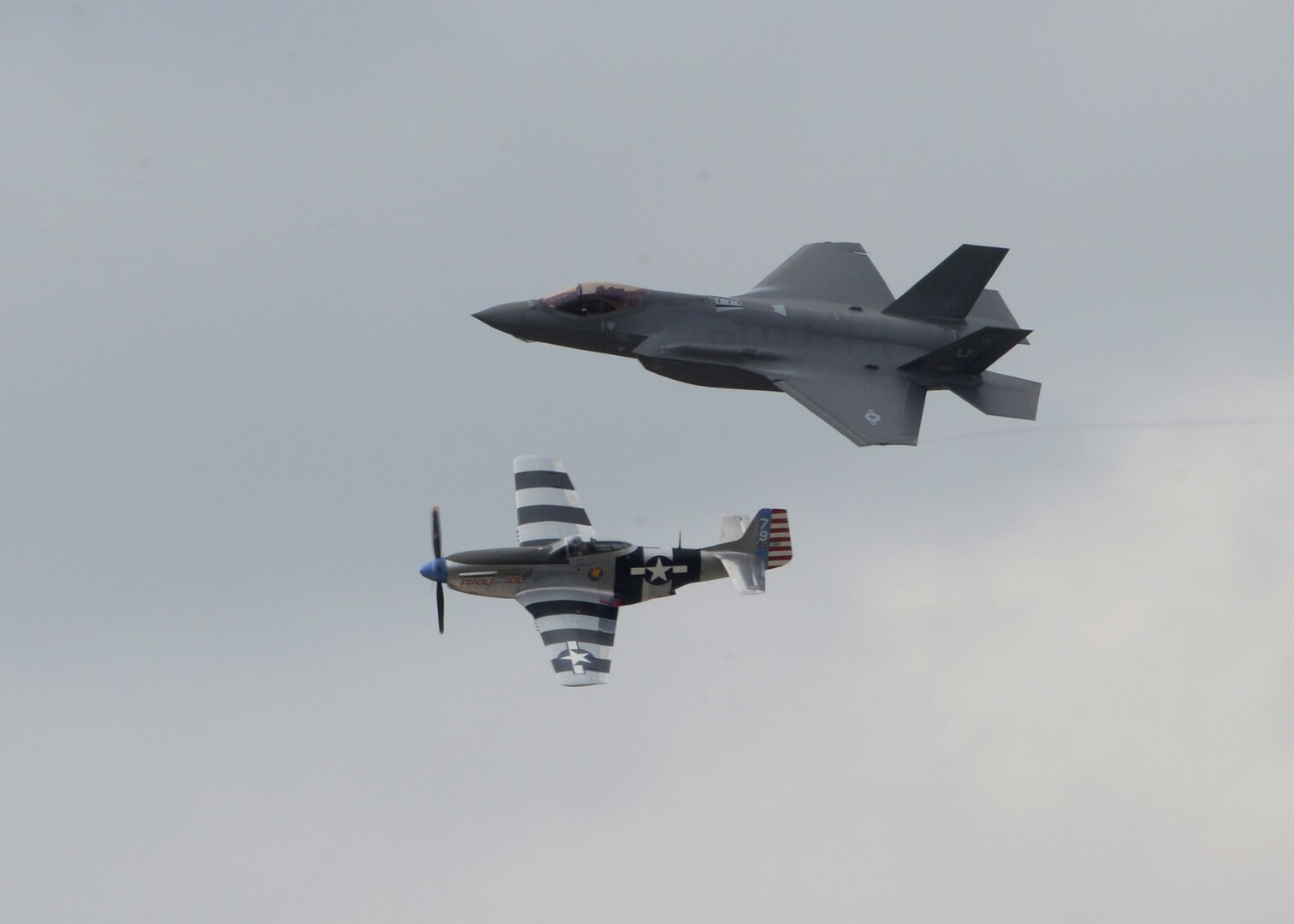 F-35 Demo Team and P-51 Mustang perform a Heritage flight during the 2017 Joint Base San Antonio Air Show and Open House Nov. 4, at JBSA-Lackland, Kelly Field Annex.  Air shows allow the U.S. military and civilian demonstration teams to display their capabilities through aerial demonstrations and static displays.  The air show gives attendees an opportunity to get up close and personal to see some of the equipment and aircraft used by the U.S. military today. (U.S. Air Force photo by Melissa Peterson/Released)